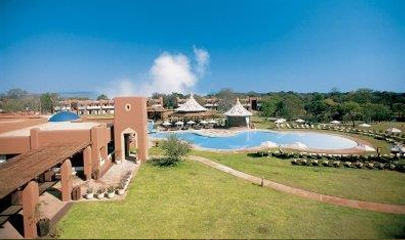 Aerial view of the hotel and swimming pool with the Falls mist in the background